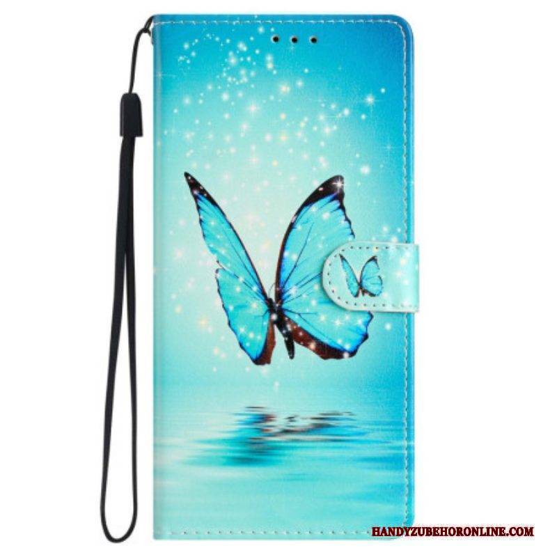 Lederhüllen Für iPhone 15 Mit Kordel Blauer Schmetterling Im Flug Mit Riemen